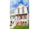 Attractive townhome showcasing classic architectural details and a welcoming entrance at 9512 W Ontario Dr, Littleton, CO 80128