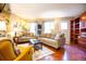 Cozy living room featuring plush seating, hardwood floors, and ample natural light at 9512 W Ontario Dr, Littleton, CO 80128