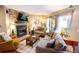 Well-lit living room boasting a fireplace, cozy seating, and stylish decor at 9512 W Ontario Dr, Littleton, CO 80128