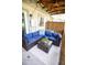 An outdoor patio with comfortable seating area on the patio with a view of the yard at 9512 W Ontario Dr, Littleton, CO 80128