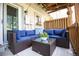 An outdoor patio with comfortable seating area on the patio with a view of the yard at 9512 W Ontario Dr, Littleton, CO 80128