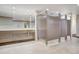 Modern bathroom featuring individual stalls, a large mirror, and sleek tiling at 2900 Shadow Creek Dr # 201, Boulder, CO 80303