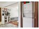 An extra room with in unit washer and dryer, shelving, and a uniquely decorated living space at 2900 Shadow Creek Dr # 201, Boulder, CO 80303