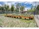 Community garden featuring raised garden beds and a charming pergola, fenced for added security at 2900 Shadow Creek Dr # 201, Boulder, CO 80303