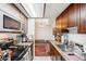 Functional kitchen featuring appliances, granite countertops, and overhead lighting at 2900 Shadow Creek Dr # 201, Boulder, CO 80303