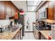 Efficient kitchen with updated appliances, granite counters, and ample cabinet space at 2900 Shadow Creek Dr # 201, Boulder, CO 80303