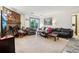 Spacious living room with balcony access, a decorative fireplace, and cozy seating arrangement at 2900 Shadow Creek Dr # 201, Boulder, CO 80303