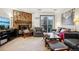 Cozy living room features a fireplace, sliding glass doors to the balcony, and comfortable seating at 2900 Shadow Creek Dr # 201, Boulder, CO 80303