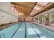 Indoor swimming pool with vaulted wood beam ceiling and lots of natural light at 2900 Shadow Creek Dr # 201, Boulder, CO 80303