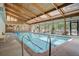 Indoor swimming pool with vaulted wood beam ceiling and lots of natural light at 2900 Shadow Creek Dr # 201, Boulder, CO 80303