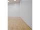Well-lit racquetball court featuring hardwood floors and pristine white walls at 2900 Shadow Creek Dr # 201, Boulder, CO 80303