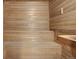 Interior shot of a wood lined sauna, includes seating and a temperature gauge at 2900 Shadow Creek Dr # 201, Boulder, CO 80303