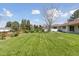 View of the expansive backyard from the left corner of the property at 3775 S Forest Way, Denver, CO 80237