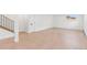 Finished basement with light wood floors, an egress window, and access to the upper level at 3775 S Forest Way, Denver, CO 80237