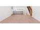 Large open basement with a new countertop and cabinets and open staircase to the upper floors at 3775 S Forest Way, Denver, CO 80237