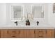 Modern bathroom with dual sinks, quartz countertops, and trendy wood grain cabinets at 3775 S Forest Way, Denver, CO 80237