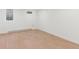 Bright bedroom with hardwood floors, white walls and modern window at 3775 S Forest Way, Denver, CO 80237