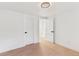 Bright bedroom with hardwood floors and freshly painted white walls and trim at 3775 S Forest Way, Denver, CO 80237