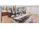 Stylish dining and kitchen area featuring a large table and modern countertops at 3775 S Forest Way, Denver, CO 80237