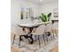 Bright dining area with hardwood floors and ample space for entertaining guests at 3775 S Forest Way, Denver, CO 80237