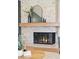 Cozy fireplace featuring stone surround, wood mantle, and decorative accents creating a warm ambiance at 3775 S Forest Way, Denver, CO 80237