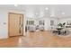 Bright open-concept living space with hardwood floors and abundant natural light at 3775 S Forest Way, Denver, CO 80237