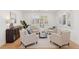 Inviting living area features neutral tones, comfortable seating and hardwood floors at 3775 S Forest Way, Denver, CO 80237