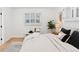 Serene bedroom showcasing natural light, hardwood floors, neutral tones, and stylish decor at 3775 S Forest Way, Denver, CO 80237