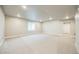 Expansive basement featuring neutral carpet, recessed lighting, and a window for lots of natural light at 12574 Lake View St, Longmont, CO 80504