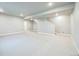 An expansive basement featuring neutral carpet, recessed lighting, and a staircase leading to the main floor at 12574 Lake View St, Longmont, CO 80504