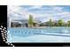 Community pool with many amenities including a large deck and splash pad for children at 12574 Lake View St, Longmont, CO 80504