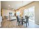 Bright dining area with access to the back patio and seamlessly connected to the adjacent living area at 12574 Lake View St, Longmont, CO 80504