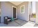 Inviting front porch featuring a cozy chair and stylish decor at 12574 Lake View St, Longmont, CO 80504