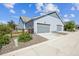 Two-car garage with an extra driveway providing extra parking space at 12574 Lake View St, Longmont, CO 80504