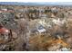 Scenic aerial view of a charming home nestled in a tranquil neighborhood with tree-lined streets and lush landscaping at 9742 Burntwood Ct, Highlands Ranch, CO 80126