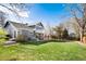 Large, well-maintained backyard with a lush lawn, two-level deck and privacy fence, ideal for outdoor activities at 9742 Burntwood Ct, Highlands Ranch, CO 80126