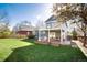 Spacious backyard with a lush green lawn and a two-level deck, perfect for outdoor entertaining at 9742 Burntwood Ct, Highlands Ranch, CO 80126