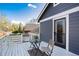 Exterior view of a house featuring a white balcony with bistro table and chairs at 9742 Burntwood Ct, Highlands Ranch, CO 80126