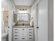 Bathroom with modern vanity, granite countertop, and updated lighting at 9742 Burntwood Ct, Highlands Ranch, CO 80126