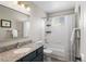 Bathroom featuring a granite countertop, a bathtub, and a shower at 9742 Burntwood Ct, Highlands Ranch, CO 80126