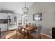 Bright dining area with modern stainless steel appliances, wood table, and access to the outdoor space at 9742 Burntwood Ct, Highlands Ranch, CO 80126