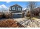 Charming two-story home featuring a blue exterior, attached garage and well-kept lawn at 9742 Burntwood Ct, Highlands Ranch, CO 80126