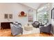 Bright and airy living room with vaulted ceilings, hardwood floors, and comfortable seating area at 9742 Burntwood Ct, Highlands Ranch, CO 80126