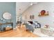 Open-concept living and dining area with hardwood floors, comfortable seating, and natural light at 9742 Burntwood Ct, Highlands Ranch, CO 80126
