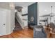 Interior view of a room with a staircase and a peek into the dining room and kitchen at 9742 Burntwood Ct, Highlands Ranch, CO 80126