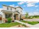 Inviting front view of a two-story house with manicured lawn and stylish stone accents at 11761 Cord Grass Way, Parker, CO 80138
