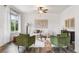 Comfortable living room with hardwood floors, neutral decor, and a view into the dining area, perfect for relaxation at 11761 Cord Grass Way, Parker, CO 80138