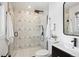 Modern bathroom featuring a glass shower enclosure, toilet, and black fixtures at 3091 S Krameria St, Denver, CO 80222