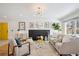 Inviting living room with a dark fireplace, comfortable seating, and stylish decor, creating a warm atmosphere at 3091 S Krameria St, Denver, CO 80222