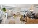 Bright living room featuring contemporary furnishings, wood floors, and a large window with snow-covered outdoor views at 3091 S Krameria St, Denver, CO 80222